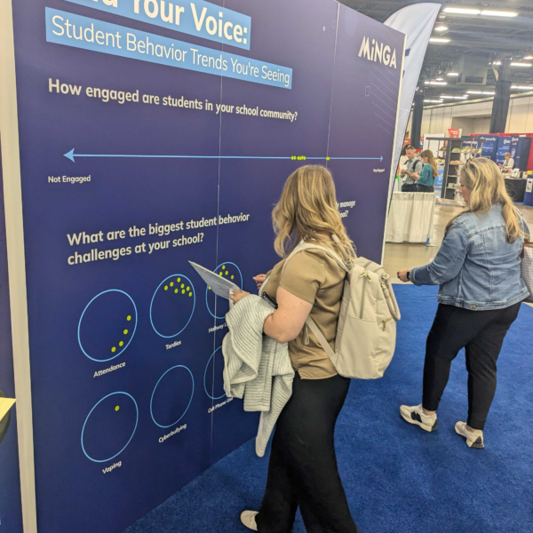 School leaders leaving stickers on Minga's engagement wall at TASSP summer conference 2026