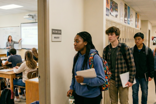 kids in a hallway, arriving late to class, for a blog post on the solution for tardiness of students