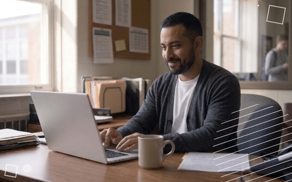 an assistant principal at a computer at his desk, looking at a tardy management dashboard