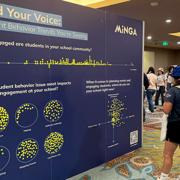 An educator engages with Minga's Engagement Wall at the CADA 2026 state convention, sharing views on student behavior trends.